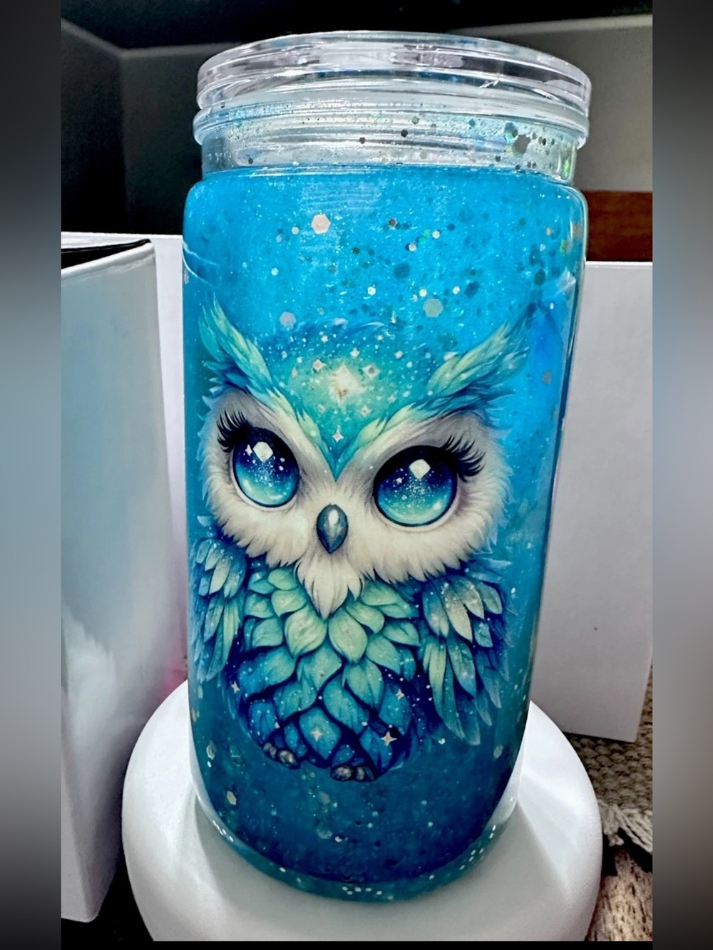 Charming blue acrylic tumbler featuring an owl design with glitter and feathers.